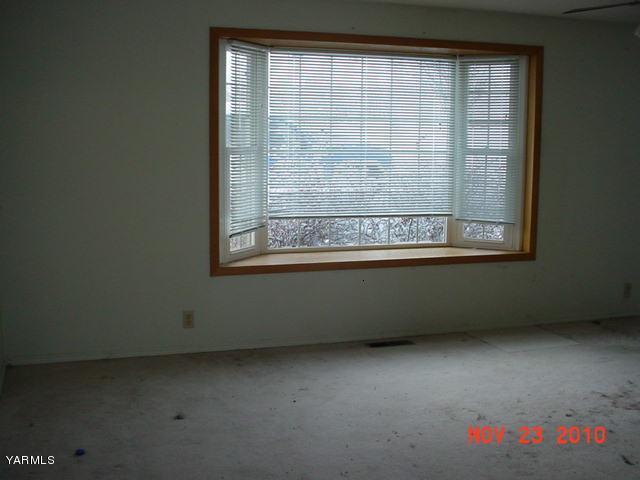 12109 Douglas Road Yakima, WA 98908 - Photo 4 of 5 a view of a room that has a window in it