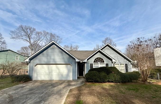 5625 Austin Garner Road Sugar Hill, GA 30518 - Photo 1 of 1 a view of a house with a yard and garage