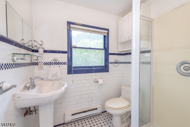 20 Wanaque Road West Milford, NJ 07421 - Photo 14 of 31 a bathroom with a sink toilet and a mirror