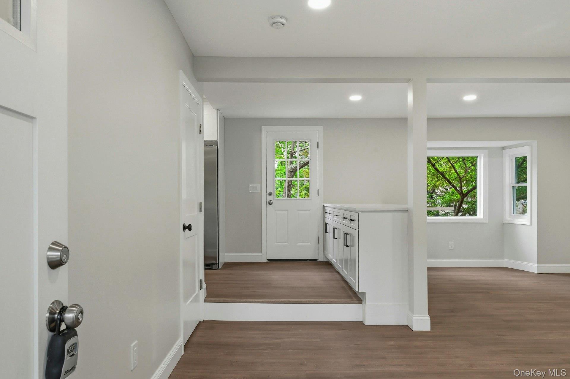 101 Rustic Road Centereach, NY 11720 - Photo 9 of 42 a view of an entryway with wooden floor and a window