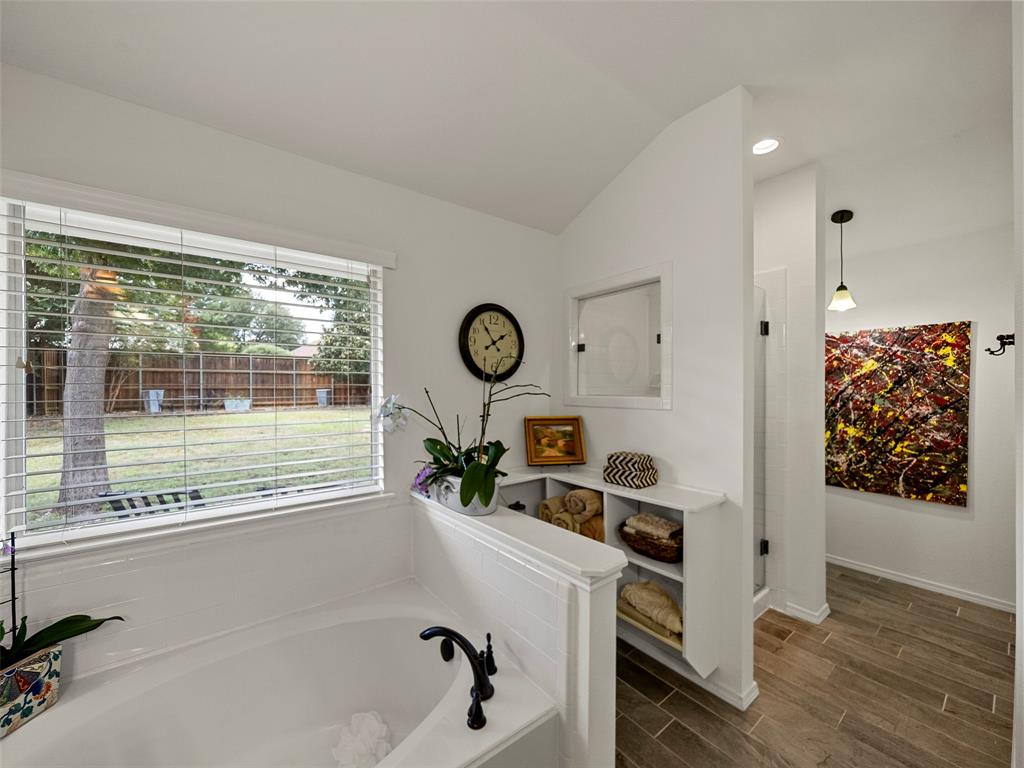 204 Arbor Ridge Drive Allen, TX 75002 - Photo 20 of 36 Soaking tub featuring a black bronze faucet