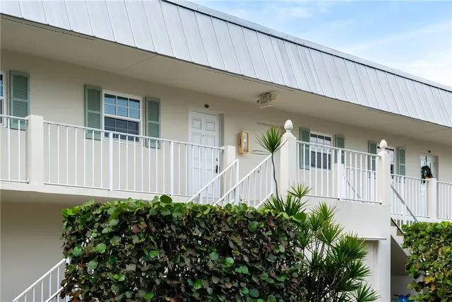 a view of a house with a flower garden