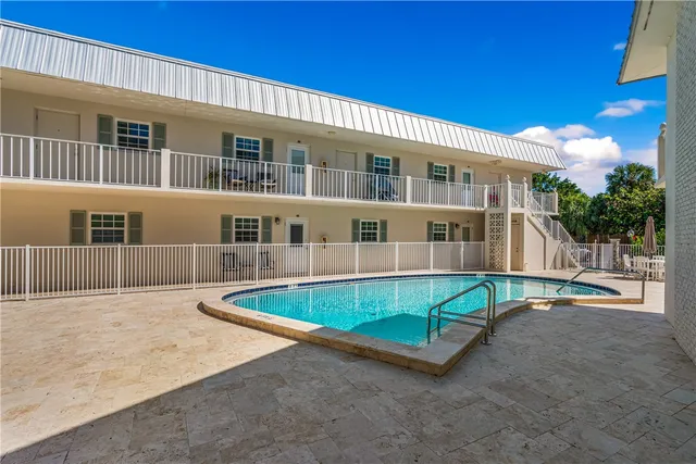 front view of a house with a swimming pool