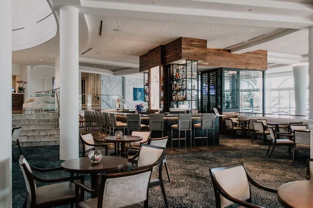 a living room with lots of furniture and window