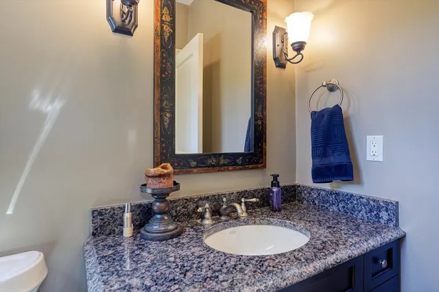 a view of a livingroom with furniture and hardwood floor