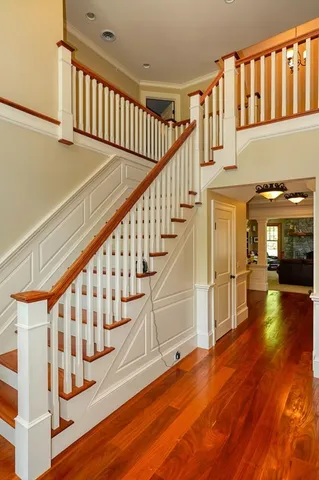 a view of a livingroom with furniture wooden floor and windows