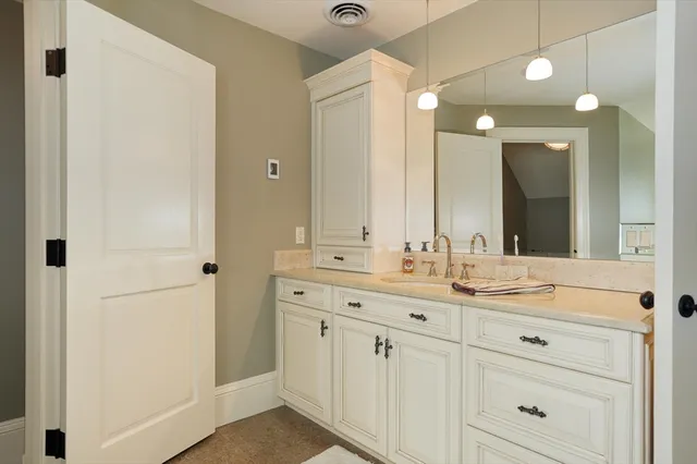 a view of walk in closet with large window