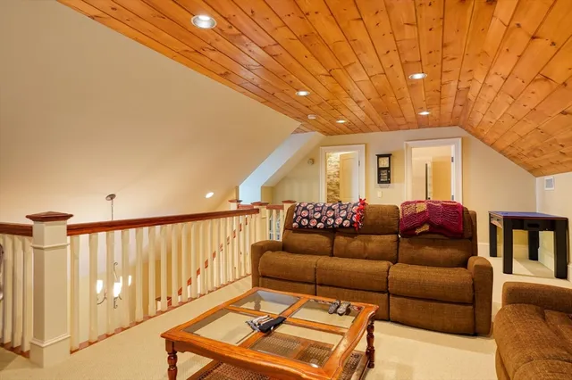 a front view of a house with a garden and yard