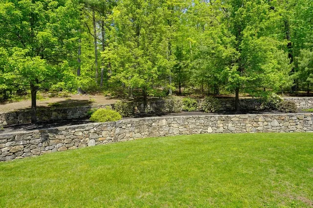 a view of a garden with an outdoor seating