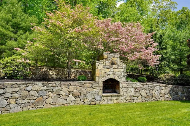 a view of house with garden and entertaining space