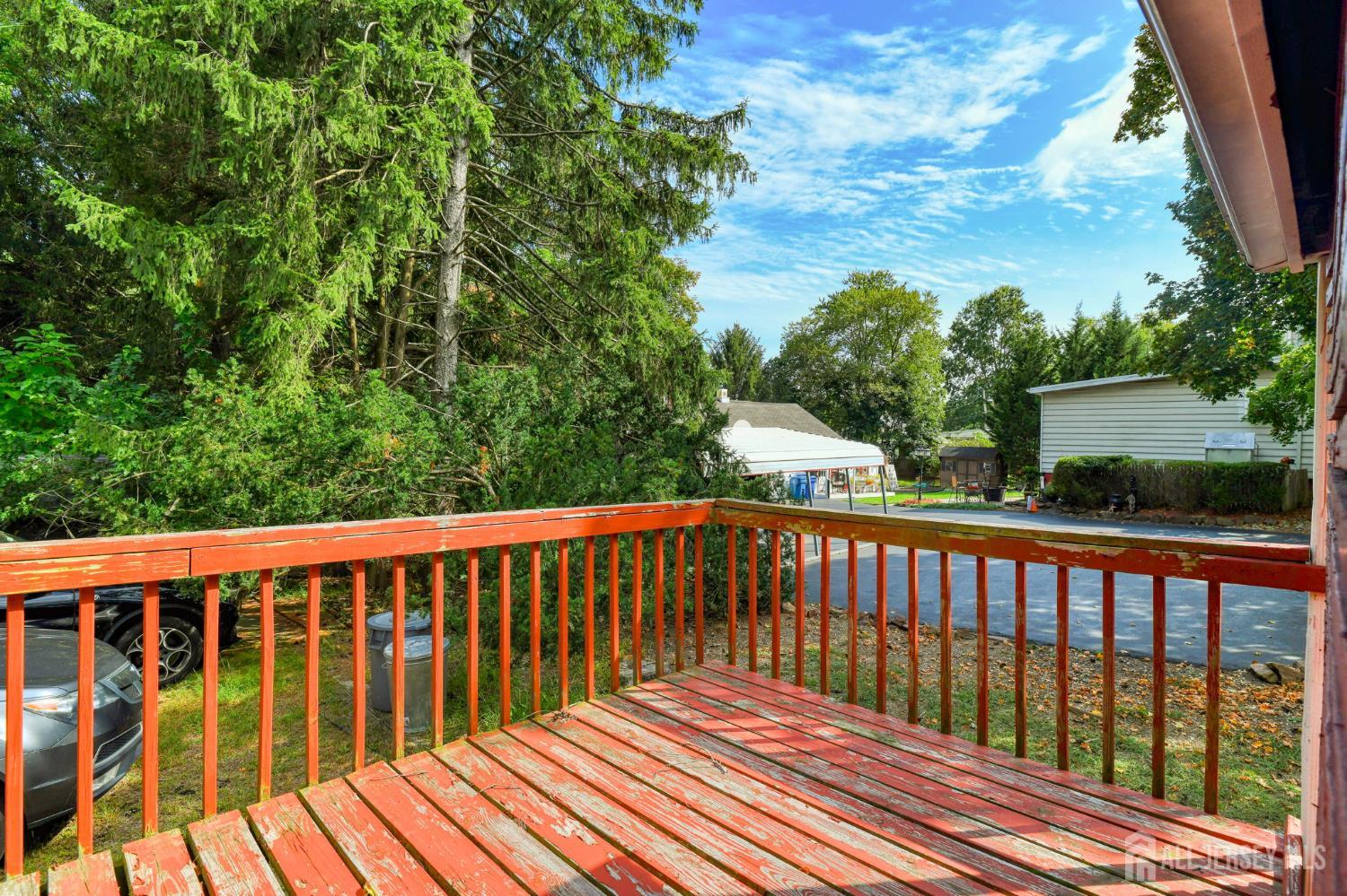 148 Helmetta Road Monroe Township, NJ 08831 - Photo 20 of 22 a balcony with wooden floor and fence