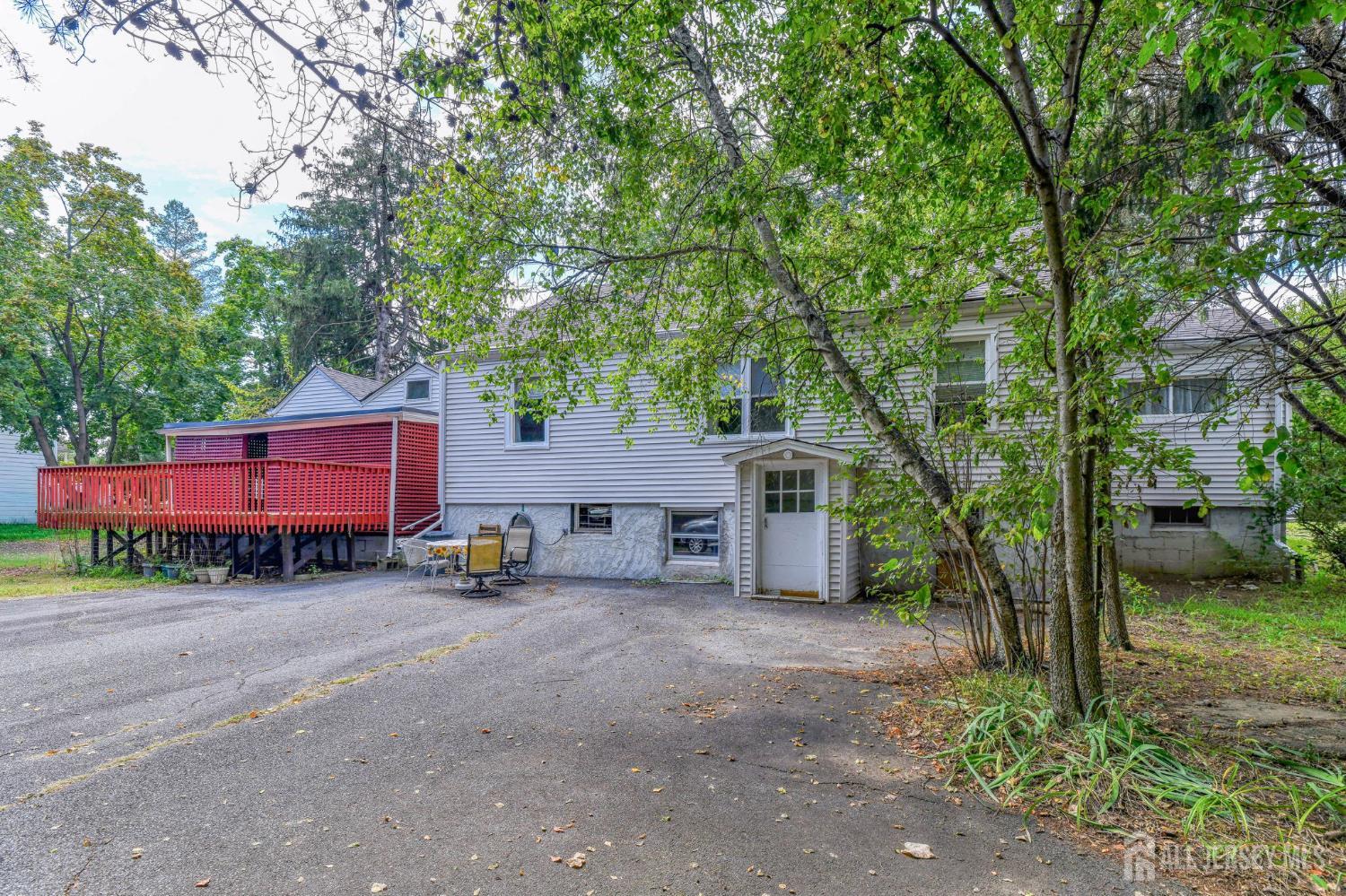 148 Helmetta Road Monroe Township, NJ 08831 - Photo 4 of 22 a red and white house with a large tree in front of it