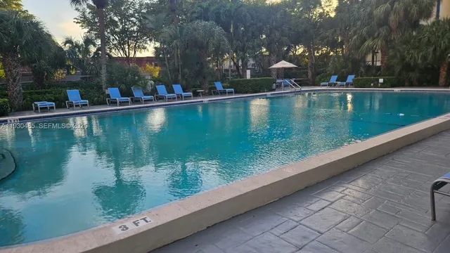 a view of swimming pool from a lake view
