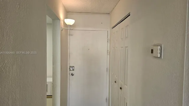 a bathroom with a shower and a glass door