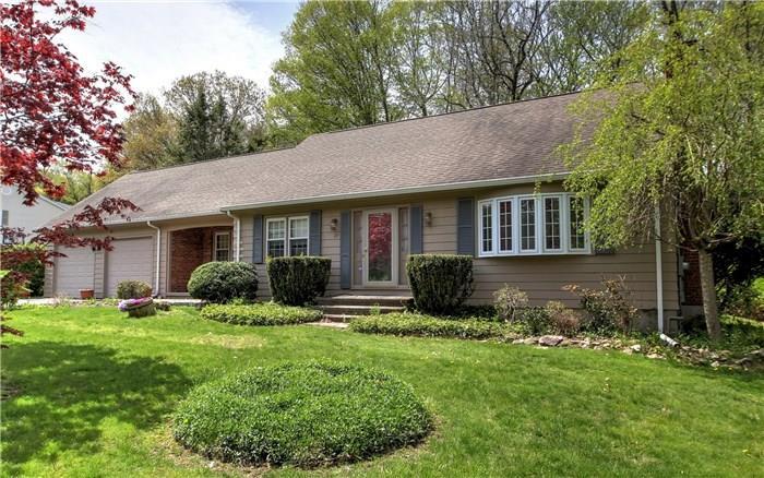 29 Pomona Road Trumbull, CT 06611 - Photo 1 of 1 a front view of a house with a yard and trees