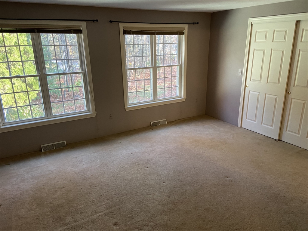 501 Ridgefield Circle, Unit B Clinton, MA 01510 - Photo 14 of 17 an empty room with windows