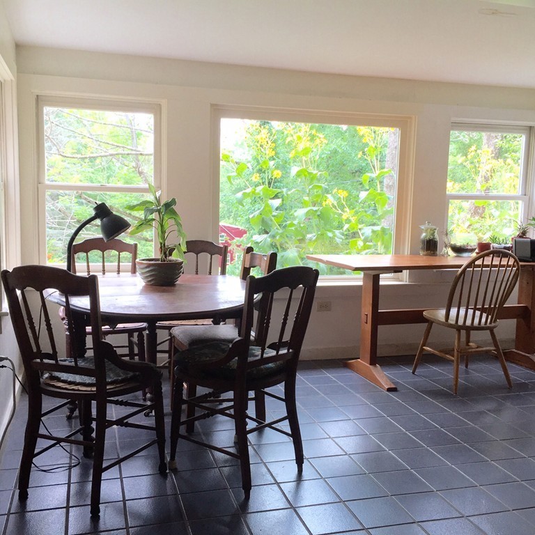 84-86 East Leverett Road Amherst, MA 01002 - Photo 5 of 29 a view of a dining room with furniture window and outside view
