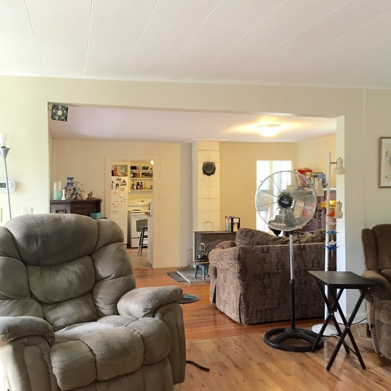 84-86 East Leverett Road Amherst, MA 01002 - Photo 9 of 29 a living room with furniture and wooden floor