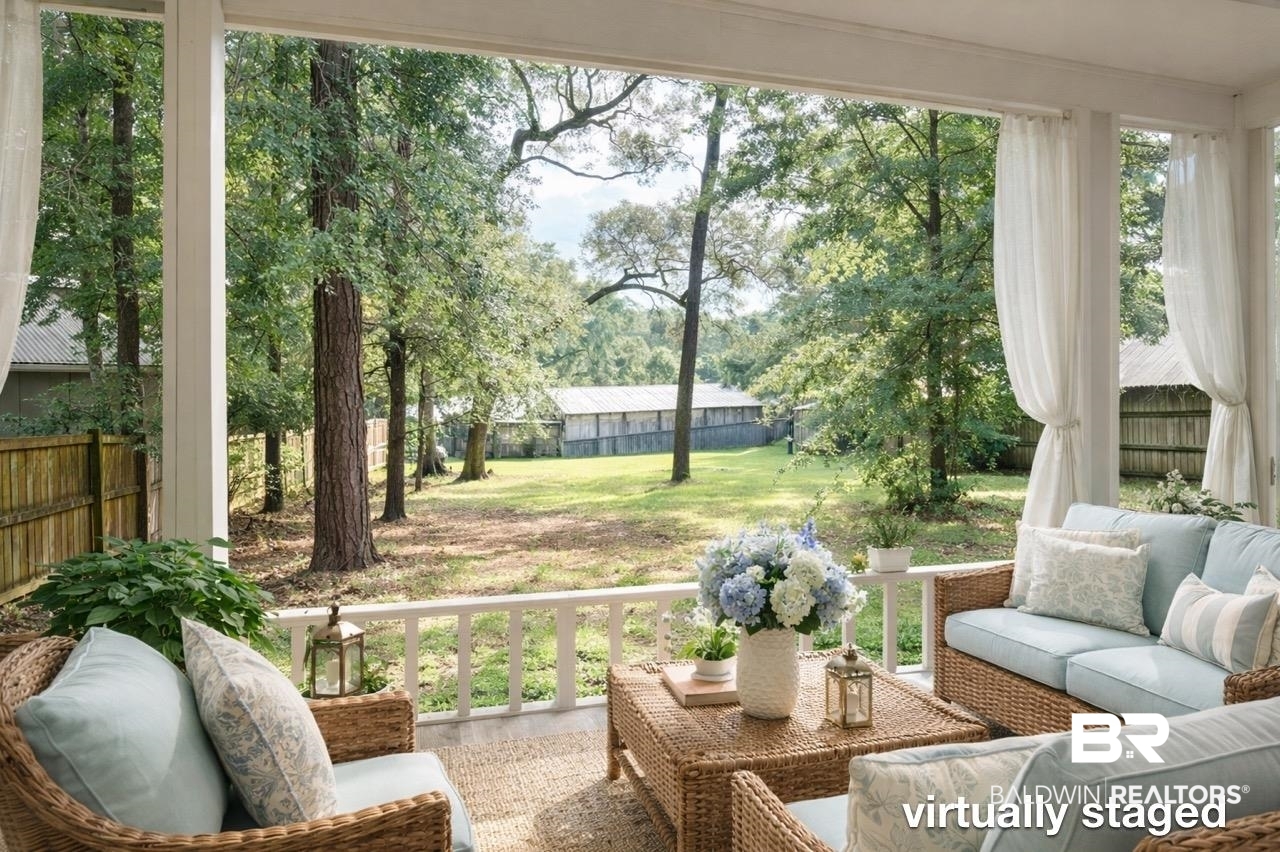 156 Pier Avenue Fairhope, AL 36532 - Photo 33 of 41 Sunroom / solarium with an outdoor lounge area and view of wooded area