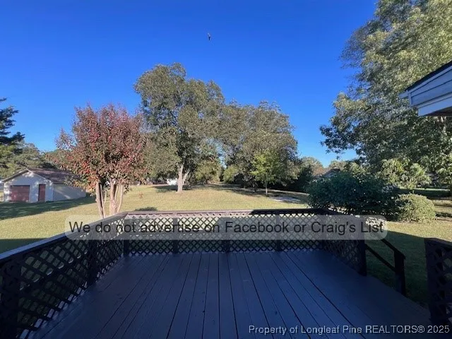 a view of a swimming pool with a yard