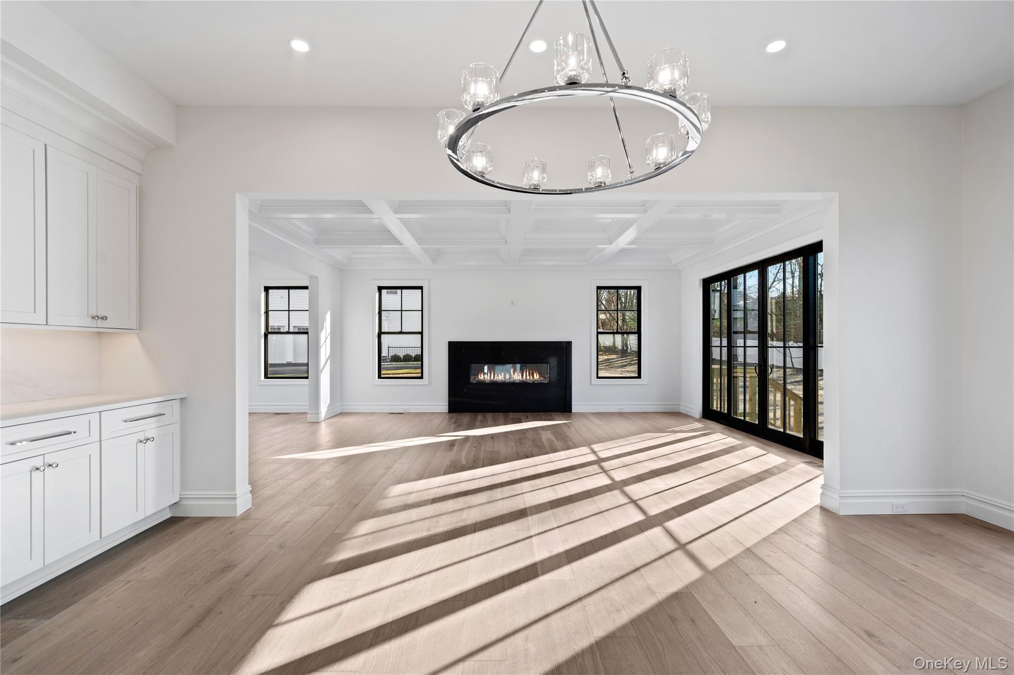 30 Main Parkway Plainview, NY 11803 - Photo 12 of 30 wooden floor fireplace and windows in a room
