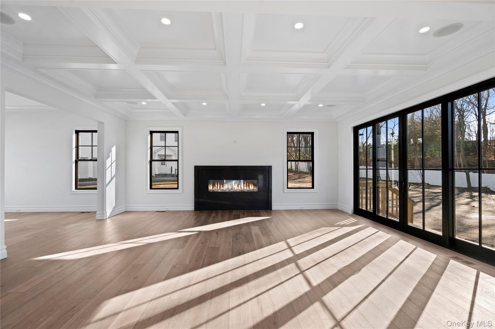 30 Main Parkway Plainview, NY 11803 - Photo 13 of 30 a view of an empty room with a fireplace and a window