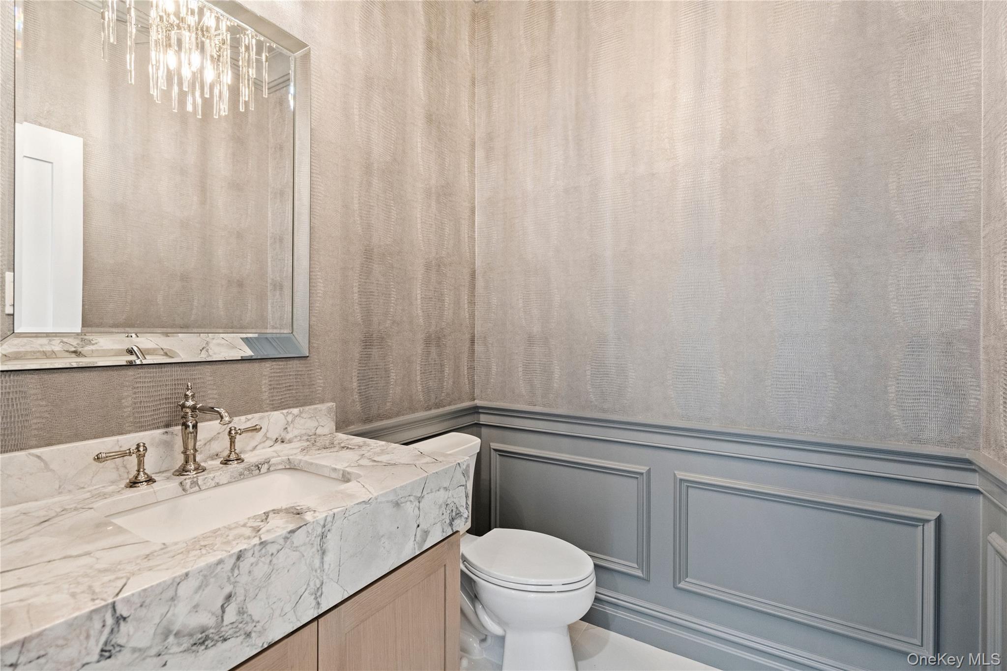 30 Main Parkway Plainview, NY 11803 - Photo 17 of 30 a bathroom with a granite countertop sink vanity mirror and toilet
