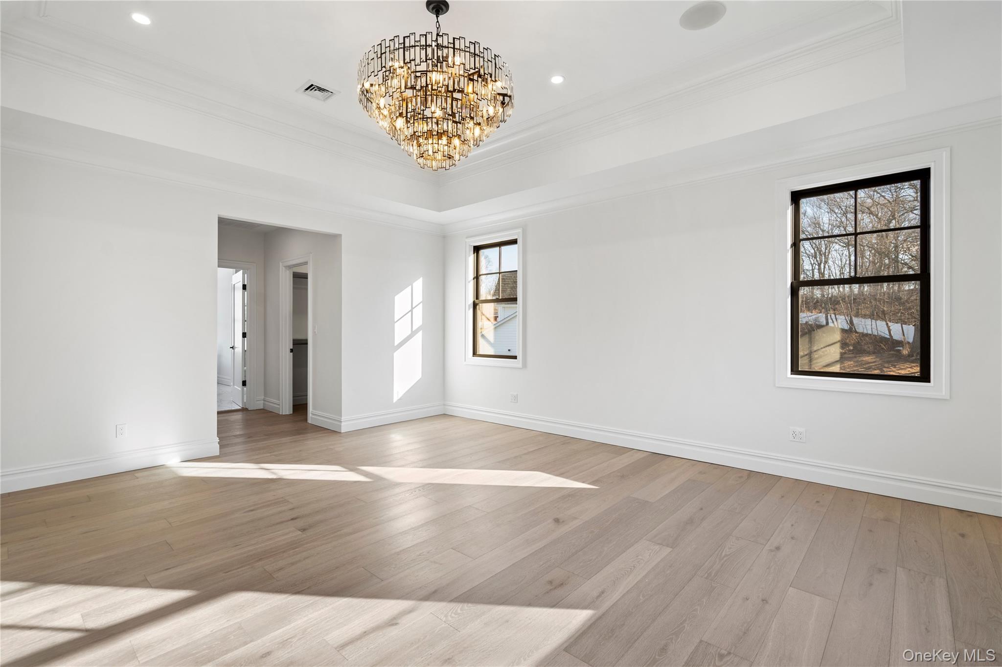 30 Main Parkway Plainview, NY 11803 - Photo 20 of 30 a view of an empty room with a window and wooden floor