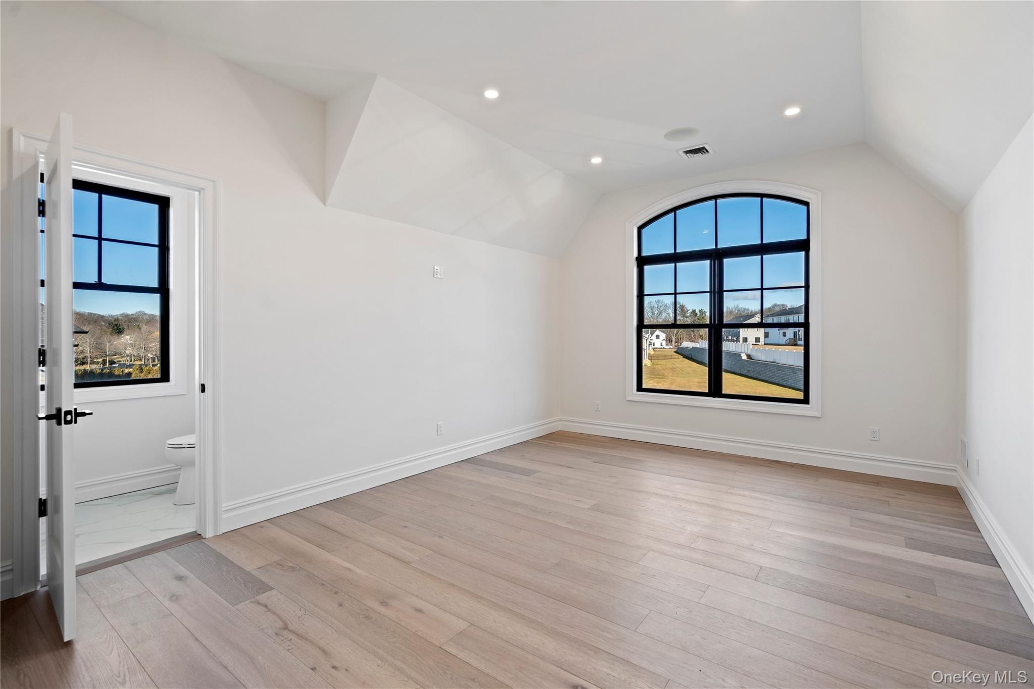 30 Main Parkway Plainview, NY 11803 - Photo 21 of 30 wooden floor in an empty room with a window