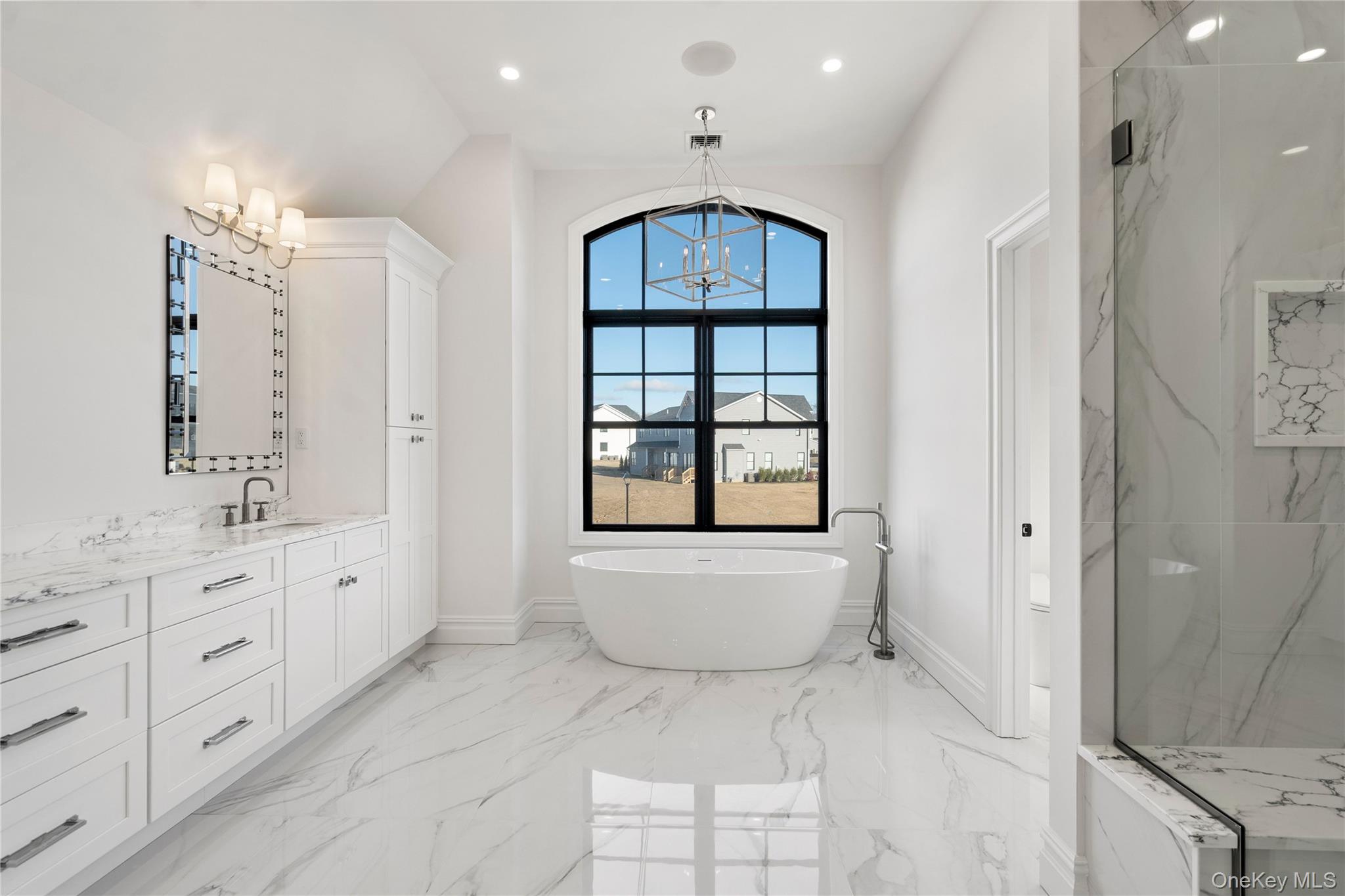 30 Main Parkway Plainview, NY 11803 - Photo 24 of 30 a bathroom with a granite countertop sink a toilet a large mirror a bathtub and window