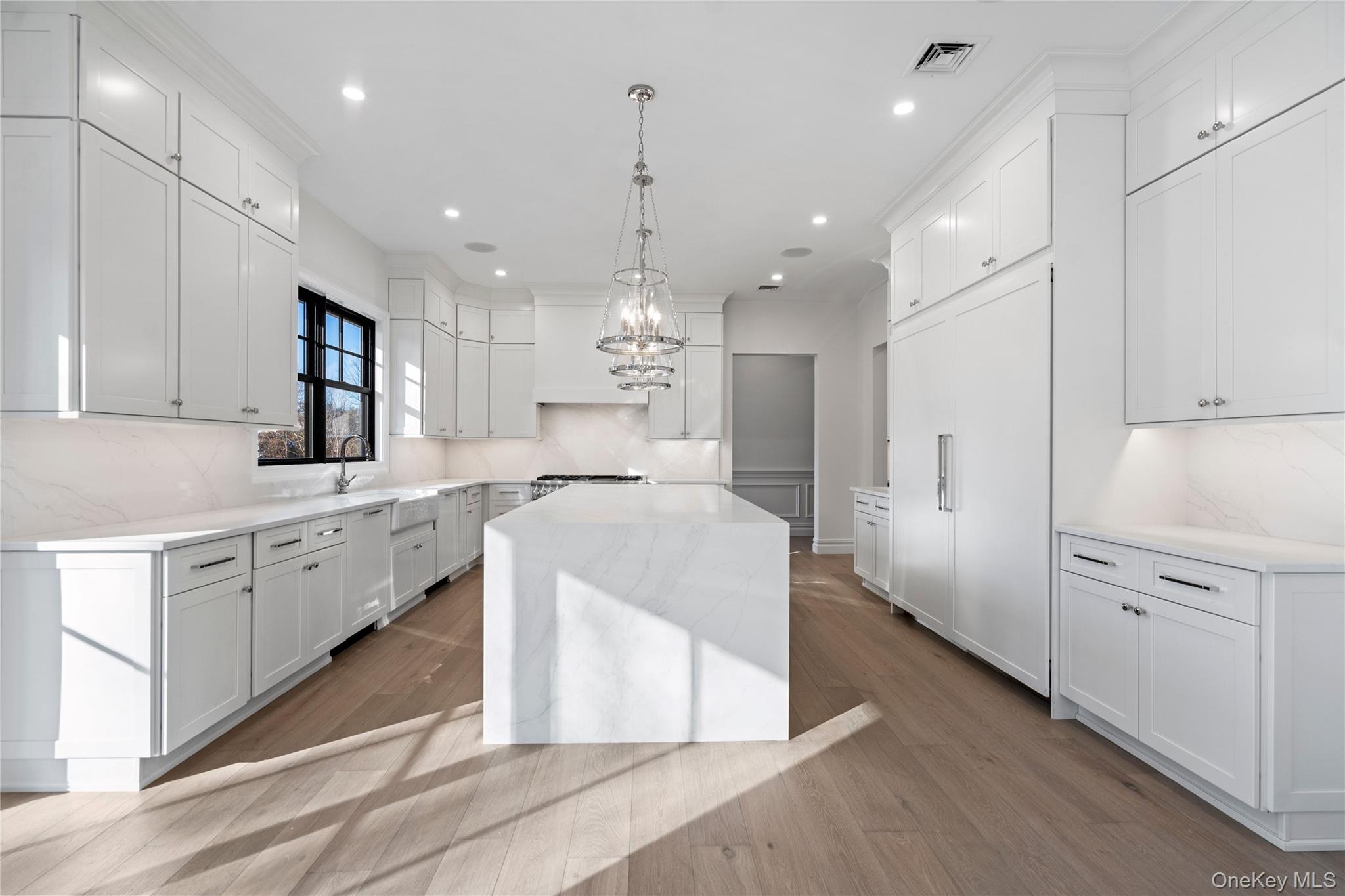 30 Main Parkway Plainview, NY 11803 - Photo 4 of 30 a large white kitchen with cabinets a sink and appliances