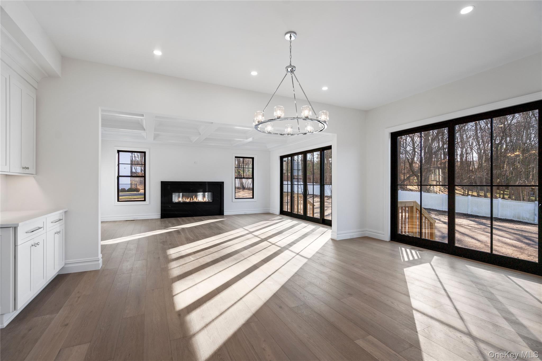 30 Main Parkway Plainview, NY 11803 - Photo 5 of 30 a view of an empty room with wooden floor and a window