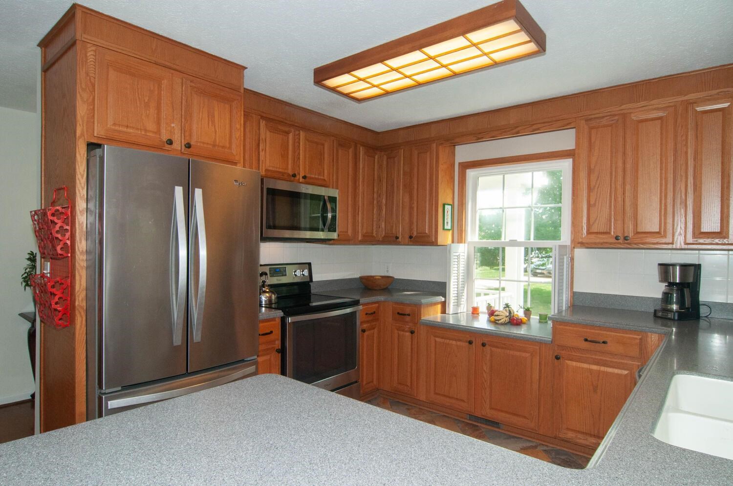 3155 Barterbrook Road Staunton, VA 24401 - Photo 14 of 59 a kitchen with granite countertop stainless steel appliances a refrigerator stove top oven and sink