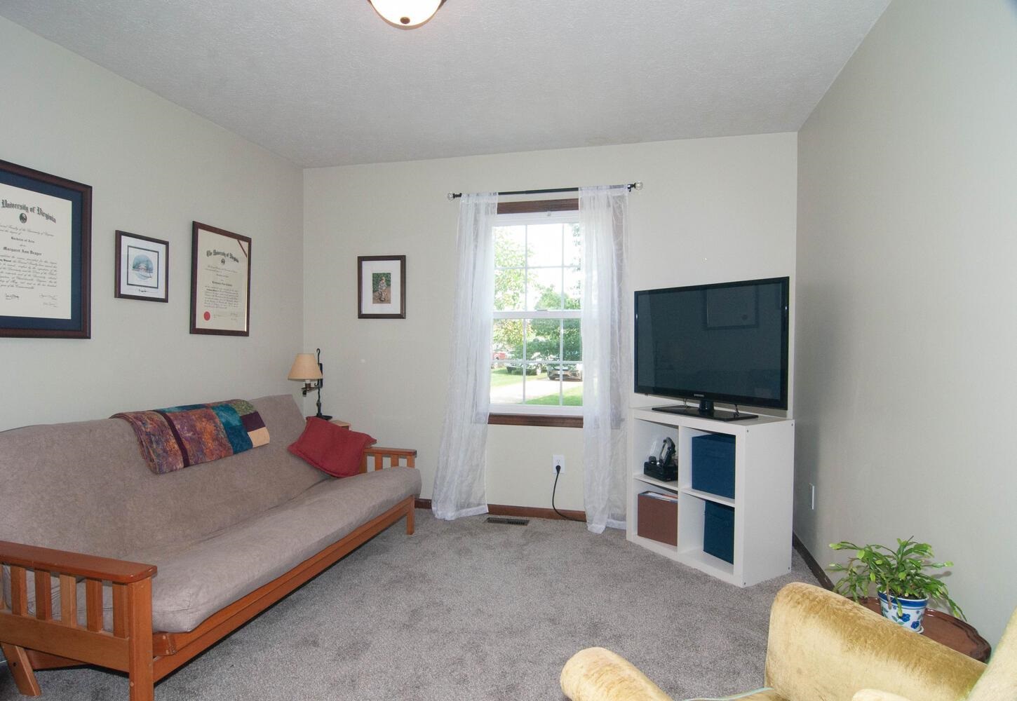 3155 Barterbrook Road Staunton, VA 24401 - Photo 16 of 59 a living room with furniture and a flat screen tv