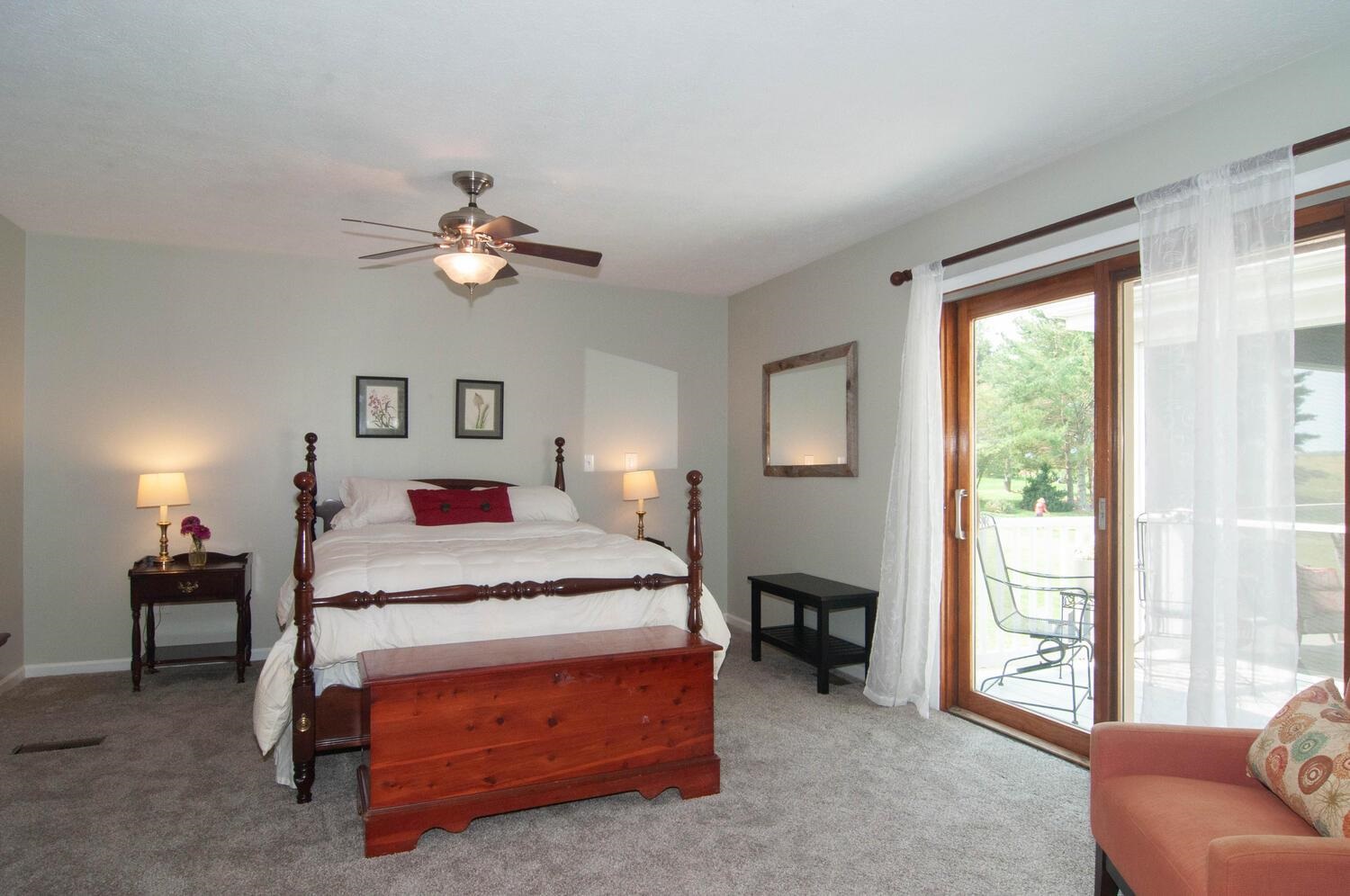 3155 Barterbrook Road Staunton, VA 24401 - Photo 19 of 59 a bedroom with a bed and a chandelier