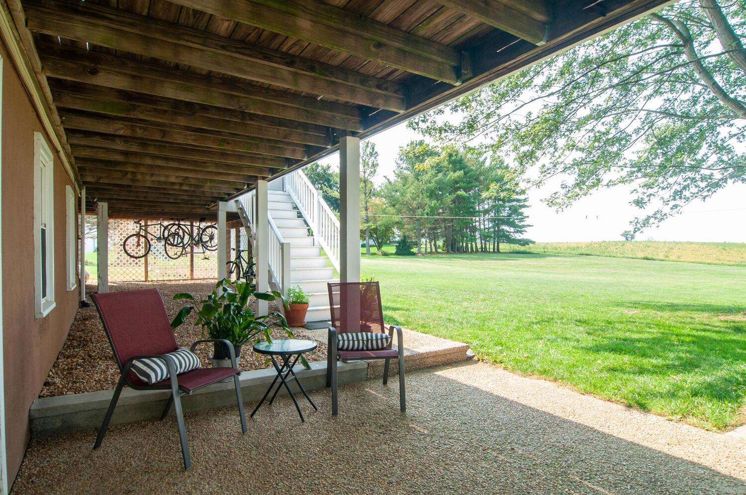 3155 Barterbrook Road Staunton, VA 24401 - Photo 49 of 59 a view of a chairs and table in patio with a yard