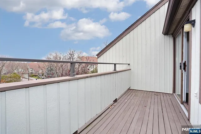 a view of balcony with wooden floor