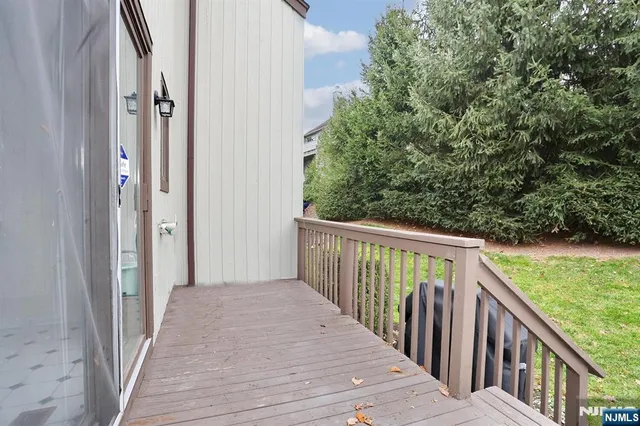 a view of a wooden deck and garden