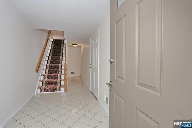 a view of an entryway with stairs