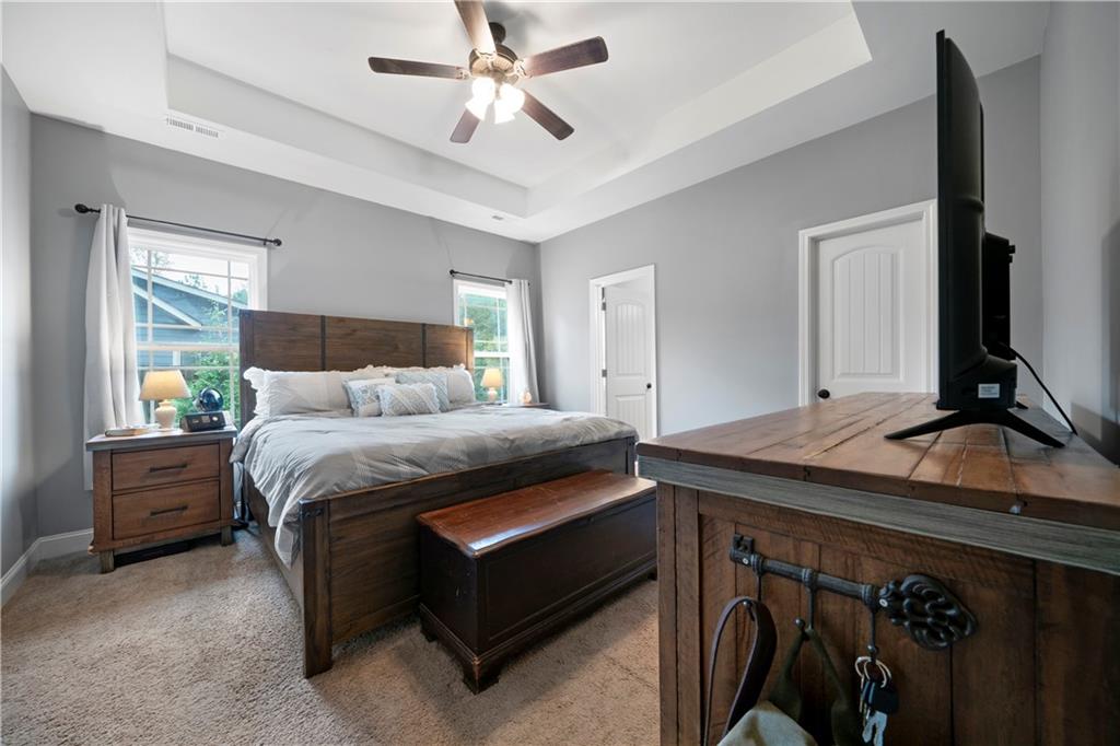 50 Round Rock Circle Northeast Rome, GA 30161 - Photo 17 of 24 a bedroom with a bed and a chandelier
