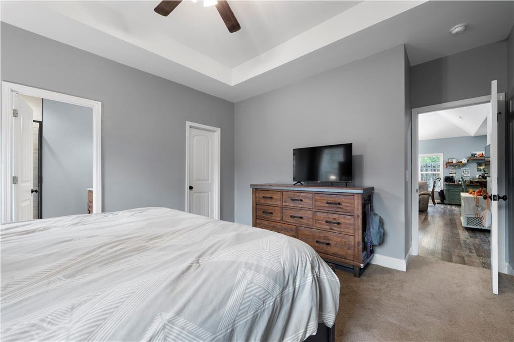 50 Round Rock Circle Northeast Rome, GA 30161 - Photo 18 of 24 a bedroom with a bed and a flat screen tv