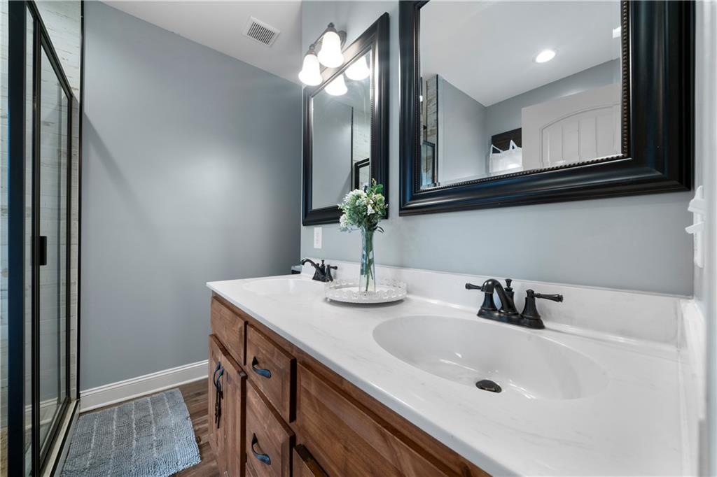 50 Round Rock Circle Northeast Rome, GA 30161 - Photo 19 of 24 a bathroom with a sink and a mirror