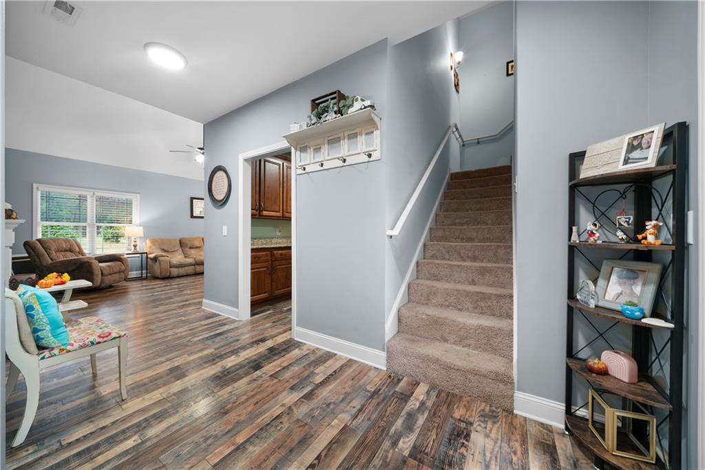 50 Round Rock Circle Northeast Rome, GA 30161 - Photo 4 of 24 a view of a hallway view with wooden floor and staircase