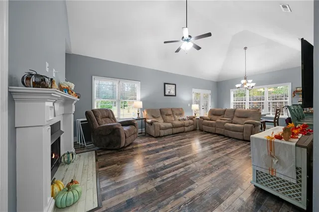 a living room with furniture fireplace and flat screen tv