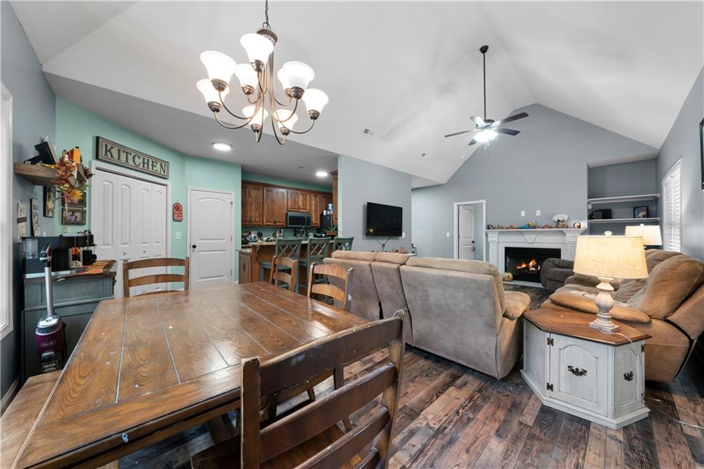 50 Round Rock Circle Northeast Rome, GA 30161 - Photo 10 of 24 a living room with furniture a fireplace and a chandelier