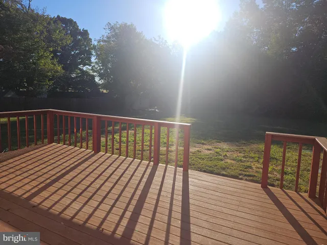 a view of a wooden fence with a bench
