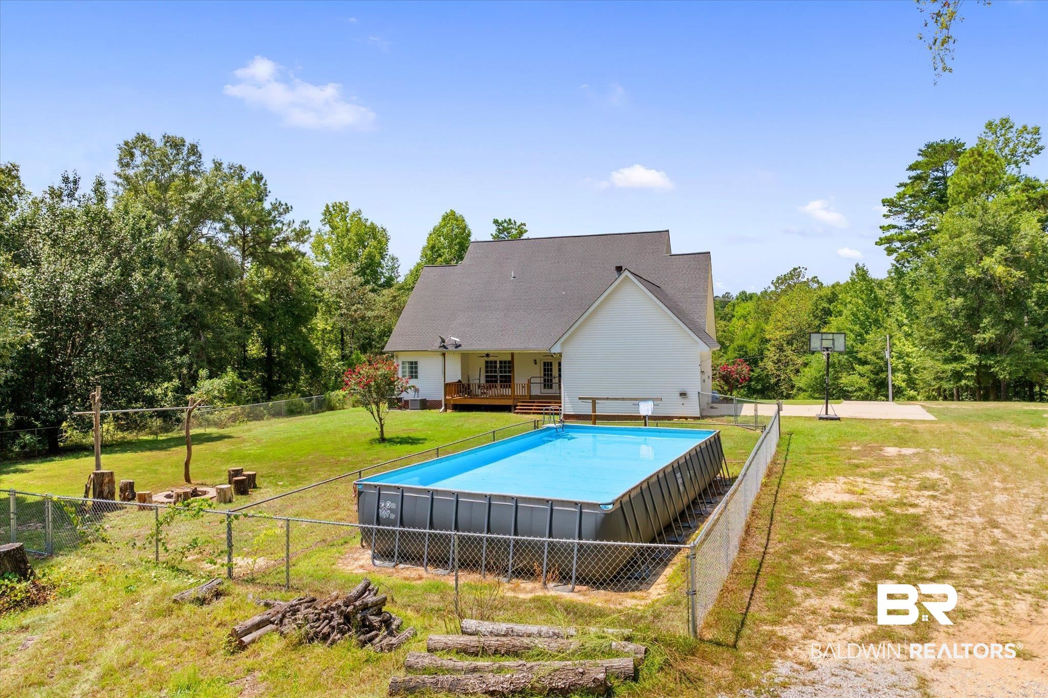 72 Limestone Drive Jackson, AL 36545 - Photo 30 of 38 View of pool featuring a lawn and a deck