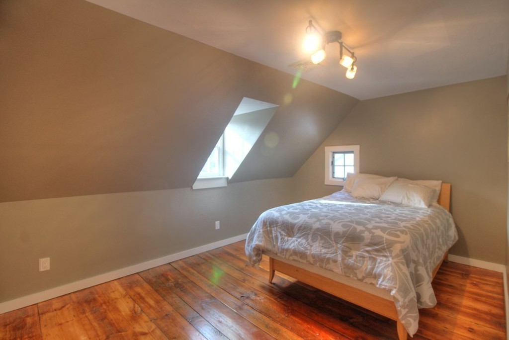 157 Fitchburg Road Townsend, MA 01469 - Photo 12 of 17 a bedroom with a bed and a lamp