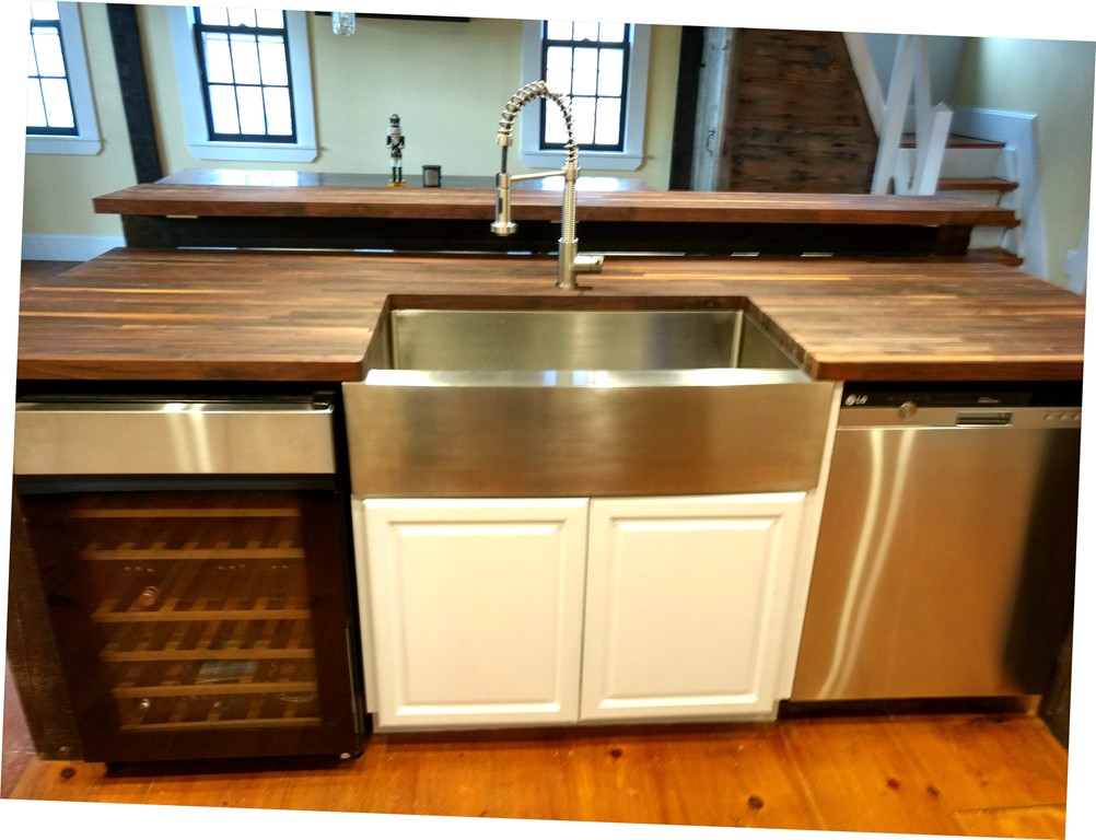 157 Fitchburg Road Townsend, MA 01469 - Photo 4 of 17 a kitchen with a sink and a refrigerator