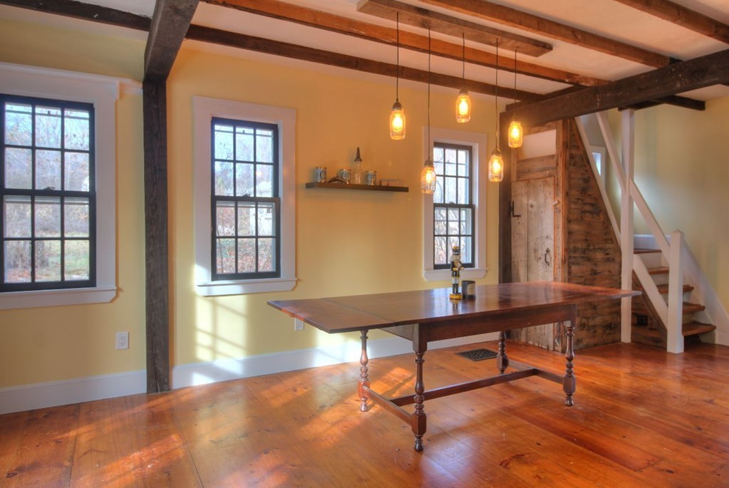 157 Fitchburg Road Townsend, MA 01469 - Photo 5 of 17 a room with table chairs and wooden floor